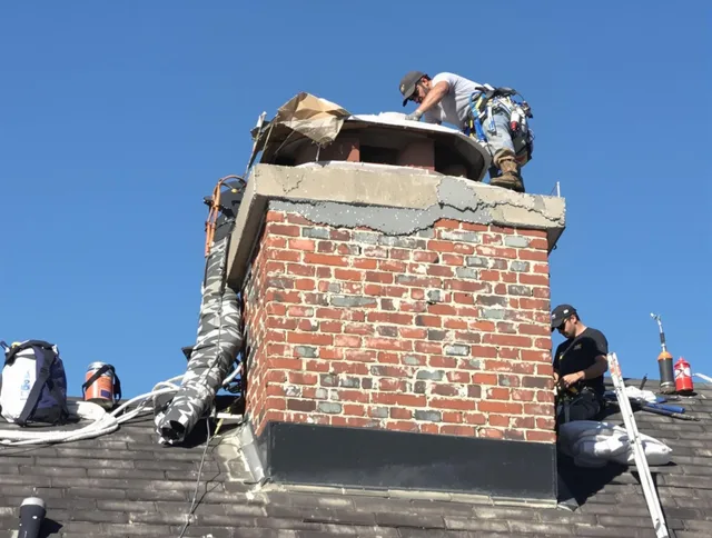 San Bernardino Chimney Sweep installing a custom chimney crown in San Bernardino, CA