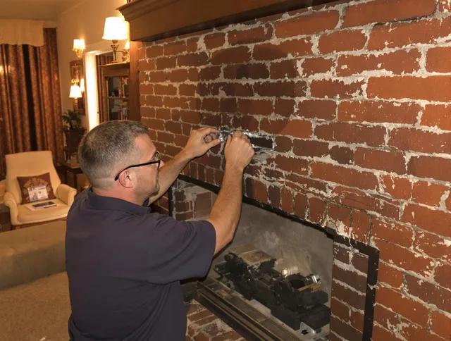 San Bernardino Chimney Sweep expert fixing a fireplace in San Bernardino, CA